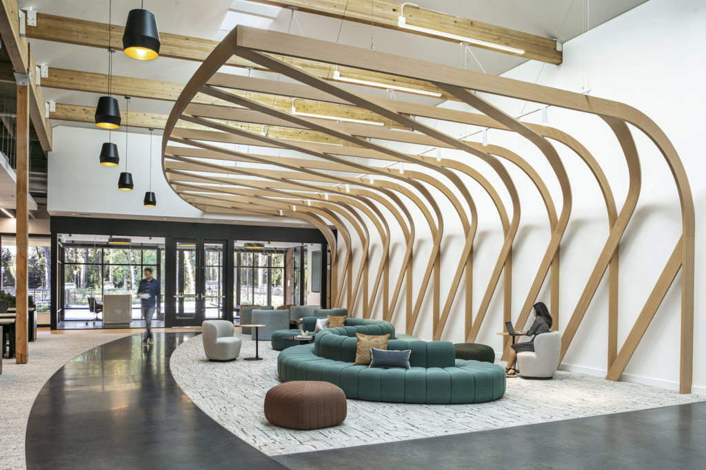A beautiful, modern lobby for a biotech company, featuring woven lumber lattice running from wall to ceiling.