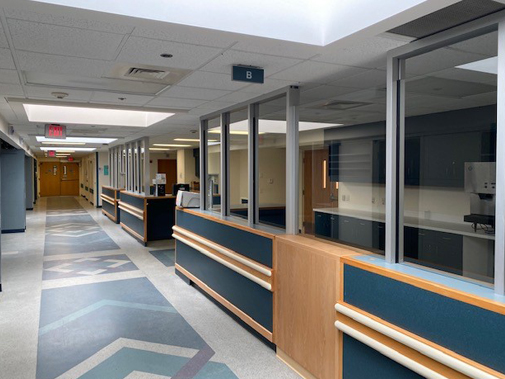 a hospital hallway with professional wood construction